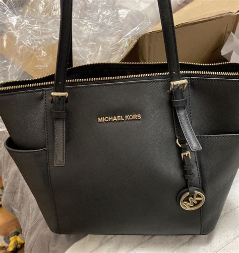 does michael kors fix purses|does michael kors repair handbags.